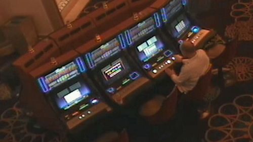 The shooter was seen casually playing poker machines and chatting with casino staff. (Supplied)