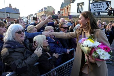 Catherine, Princess of Wales is greeted and given flowers by well-wishers during a visit to The Rainbow Centre on November 03, 2022 in Scarborough, England. 