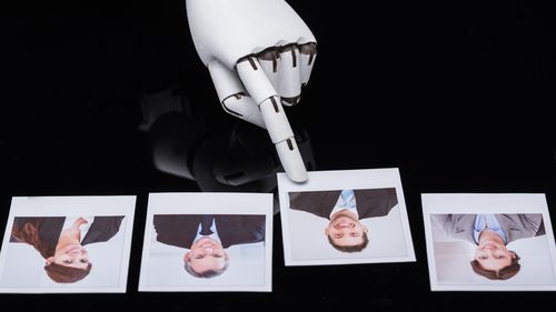 Close-up Of A Robot's Hand Selecting Candidate Photograph