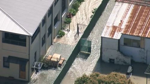 Emergency services remain at the scene, but have urged residents not to return home. (9NEWS)