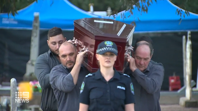 Pall bearers carry the exhumed Somerton man's coffin as investigation begins again