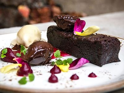 Warm vegan and gluten-free brownie with salted coconut sorbet