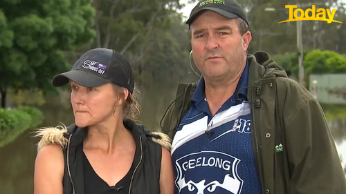 Nick and Kerri Dean said their house is 'holding up'. Floodwaters from the Murray River have reached their garage. 