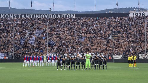 A minute's silence is held prior to the UEFA Champions League match between Greece's PAOK FC and Switzerland's FC Basel in Thessaloniki. Picture: EPA