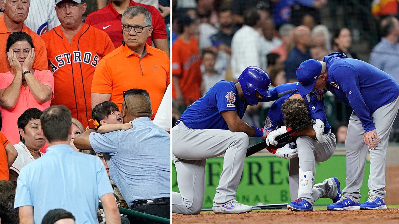 Chicago Cubs' Albert Almora Jr., center, takes a knee as Jason Heyward, left, and manager Joe Maddon, right, talk to him after hitting a foul ball into the stands