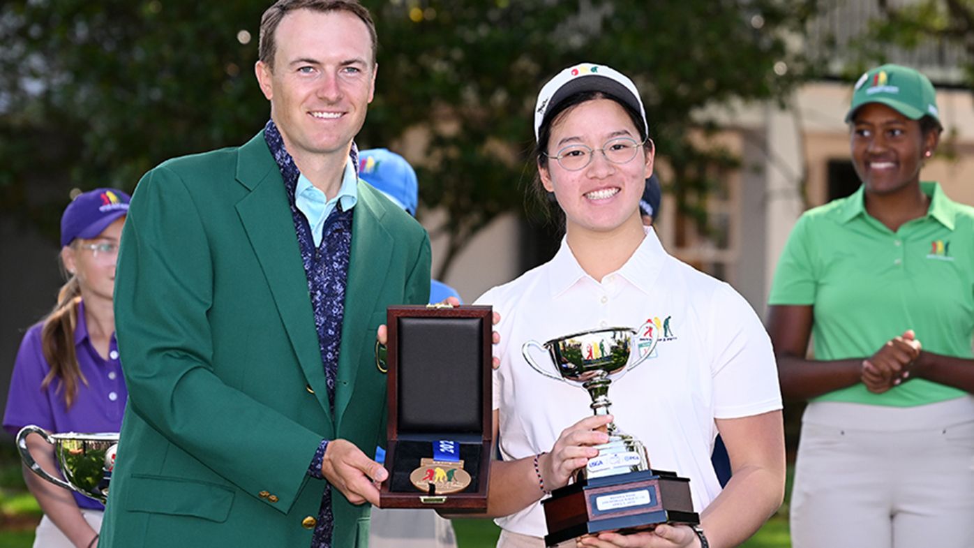 Jordan Spieth with Ruihan Kendria Wang of the Girls 12-13 group during the Drive, Chip and Putt Championship.