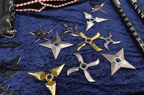 Seized bikie weapons are seen at a press conference at Australian Federal Police (AFP) headquarters in Sydney. (AAP)