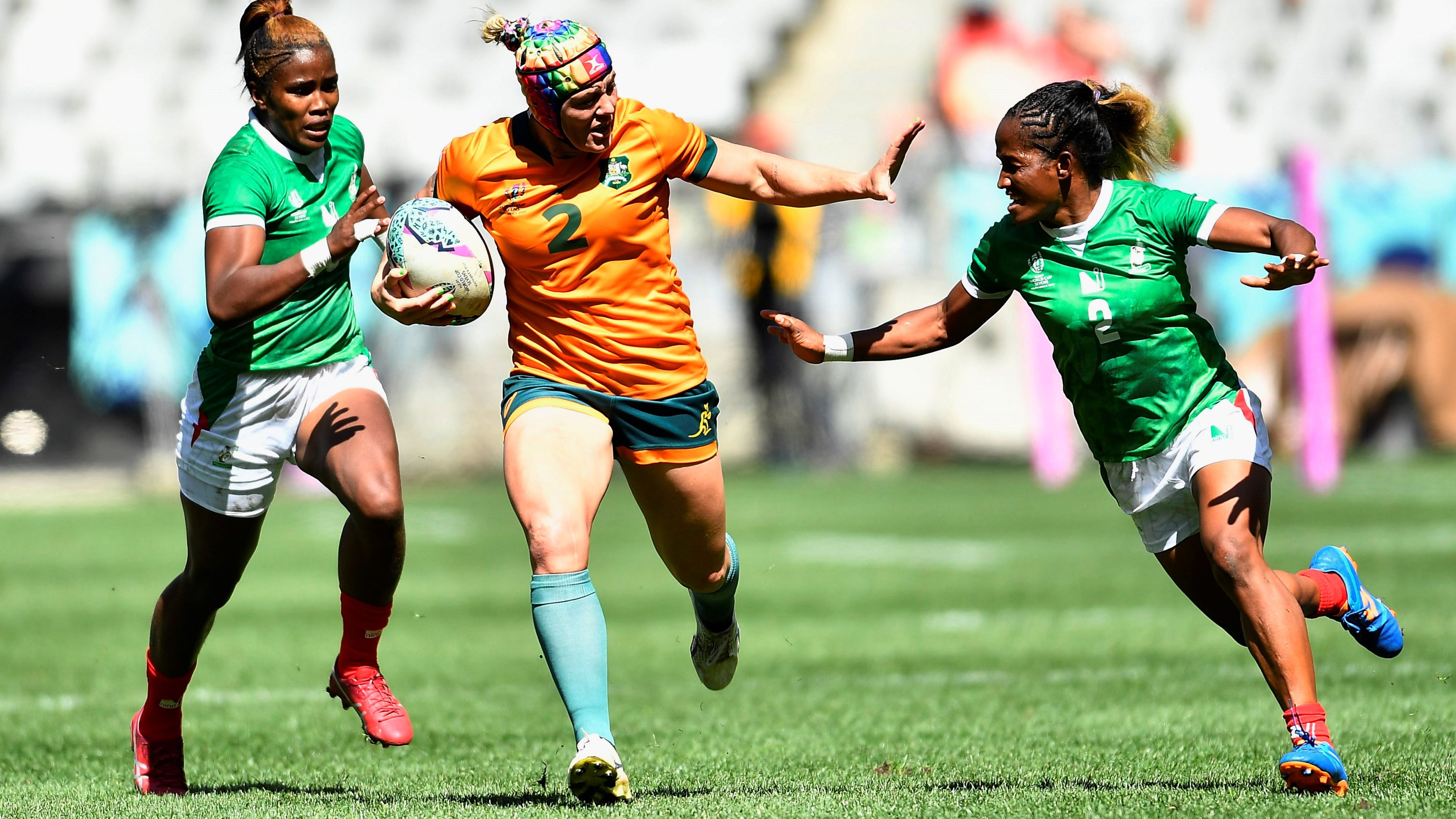 Sharni Williams fends off a Madagascar placer during the Women&#x27;s Rugby World Cup Sevens in Cape Town.