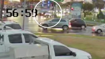 Security video shows the cars pulled up at the intersection of the Hume Highway and Cabramatta Road. 