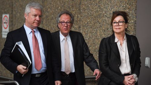 Australian actor Geoffrey Rush (centre) arrives at the Federal Court in Sydney Monday, October, 29, 2018.