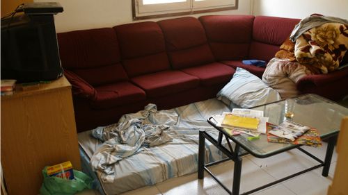 A mattress lies on the floor in an apartment where neighbours said an Imam lived after the police raided and searched the flat in Ripoll. (AP)