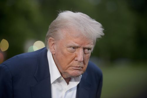 President Donald Trump speaks with reporters after disembarking Marine One upon arrival on the South Lawn of the White House in Washington, Sunday, May 4, 2025. (AP Photo/Rod Lamkey, Jr.)
