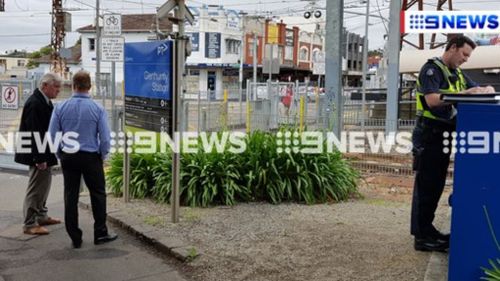 Police have arrested a man after four women were allegedly pushed onto the tracks at Glen Huntly train station. (9NEWS)