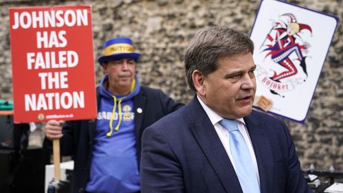 British lawmaker Andrew Bridgen speaks to the media outside the Houses of Parliament, in London. 