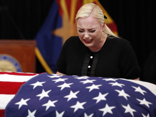 Daughter Cindy bursts into tears at the casket in Arizona.