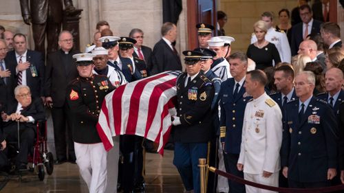 Congressional leaders have saluted John McCain today as a model of service in war and peace, in a memorial ceremony at the heart of the political battlefield where the late senator fought for more than three decades.