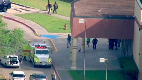 Officers respond to a Santa Fe high school near Houston, Texas, after reports of an active shooter. (AAP)