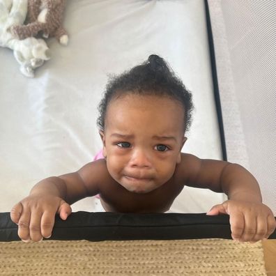 Rihanna's 10-month-old son teary in his cot. 