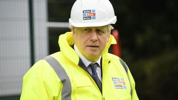 British Prime Minister Boris Johnson visits the Conway Heathrow Asphalt &amp; Recycling Plant construction site in west London on October 3, 2020 in London, England
