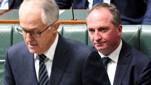 Under-pressure Barnaby Joyce sitting on the benches in Parliament behind Malcolm Turnbull today in Canberra.