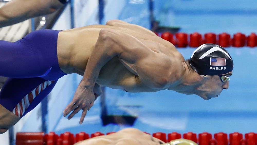 Michael Phelps takes off for his 22nd gold medal. (AFP)
