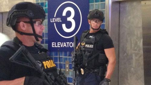 Flights were grounded at Phoenix Sky Harbor International Airport as police searched for a third shooting suspect. 