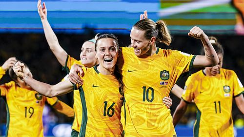 Hayley Raso and Emily Van Egmond celebrate after the Matildas' convincing 2-0 win over Denmark.