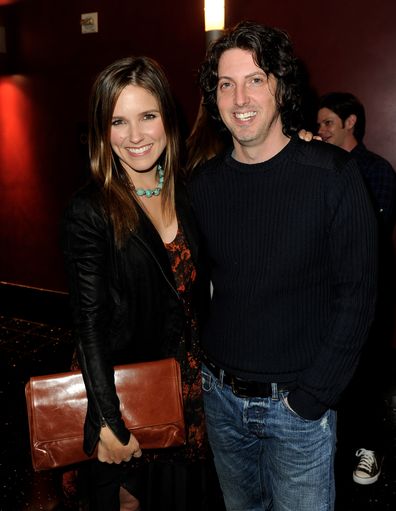 Sophia Bush and Mark Schwahn pose at a CW event in 2011