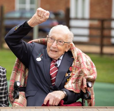 Colonel Tom Moore and his daughter Hannah celebrate his 100th birthday, with an RAF flypast provided by a Spitfire and a Hurricane over his home on April 30, 2020 in Marston Moretaine, England