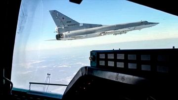 n this photo taken from video and released by the Russian Defense Ministry Press Service on Saturday, Feb. 5, 2022, A view of a  Tu-22M3 bomber of the Russian air force seen from the cockpit of another such plane during a training flight. Two Tu-22M3 long-range bombers of the Russian air force performed a patrol mission over Belarus on Saturday amid the tensions over Ukraine. (Russian Defense Ministry Press Service via AP)