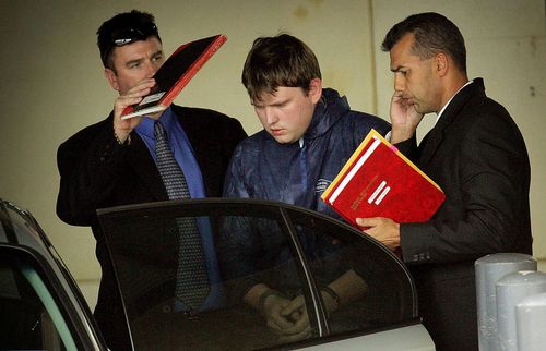 Dante Arthurs being led from Cannington Police station after being charged in June 2006. Picture: AAP