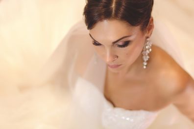 Bride sitting down ahead of wedding