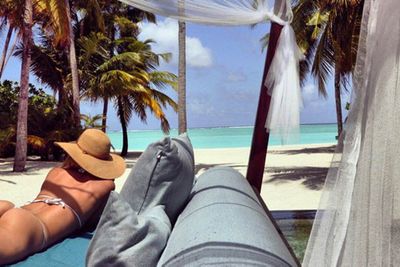 Jennifer Hawkins' model/developer hubby Jake Wall has posted a throwback photo of his famous wife's rather famous behind.

"Pass me a margarita I'm enjoying the view. #TB," Jake wrote on Instagram with the snap, which appears to be from their Maldives holiday last year.

See more shots from their sexy vacay here.