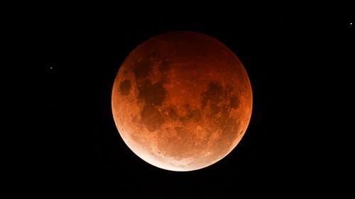 Professional photographer Stephen Scheer captured this photo of a blood moon earlier this year from Woodcroft in South Australia.