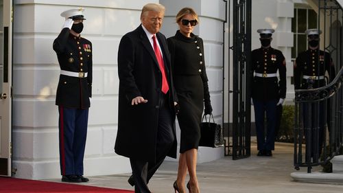 President Donald Trump and first lady Melania Trump depart the White House to board Marine One, Wednesday, Jan. 20, 2021, (AP Photo/Alex Brandon)