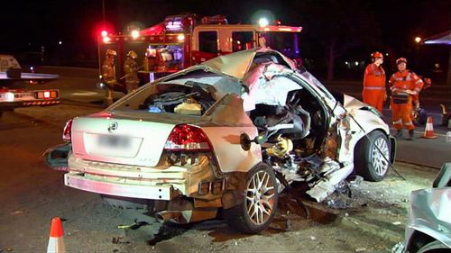 Rankin's Holden was hit by the Ford Territory, which had run a red light. (9NEWS)