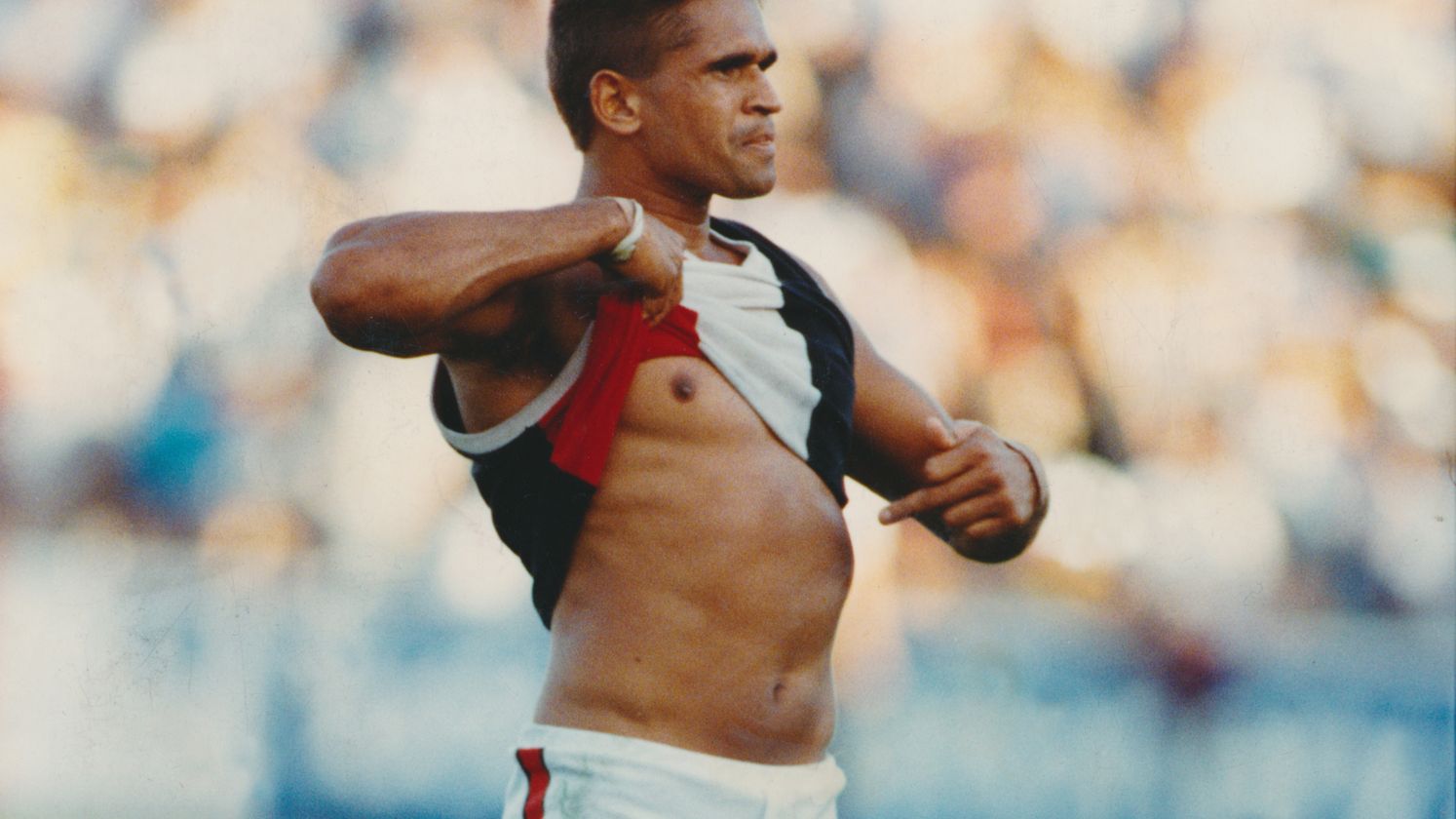 Wayne Ludbey&#x27;s iconic photo of Nicky Winmar after St Kilda defeated Collingwood in 1993. Thirty years on, Collingwood have formally apologised.