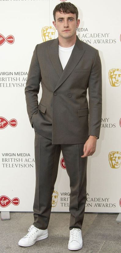 Actor Paul Mescal poses for photographers as they arrive for the British Academy Television Awards at the Television Centre in west London, Friday, July 31, 2020.