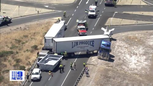 A﻿ road train has jackknifed and caused a pool to smash into a car's windscreen on a highway south of Perth.