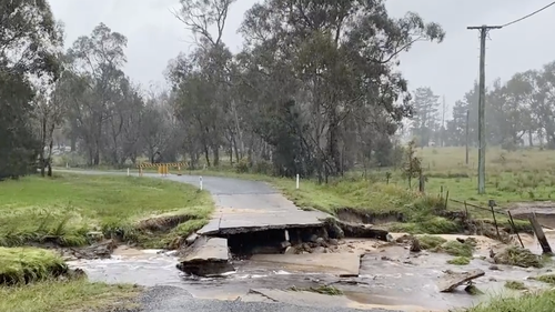A road on the outskirt of Stanthorpe washed away in a downpour. 