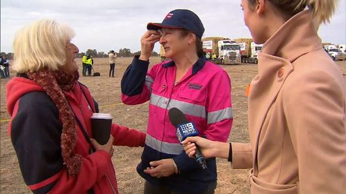 Truckie Leonie Timmins tears up speaking to farmer Chris Lee.