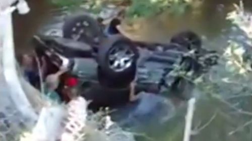 Three teen boys had to be rescued after their car crashed into a river in the US. (YouTube)