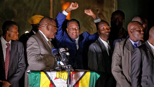 Zimbabwe's president in waiting Emmerson Mnangagwa, greets supporters gathered outside the Zanu-PF party headquarters in Harare. (Photo: AP).