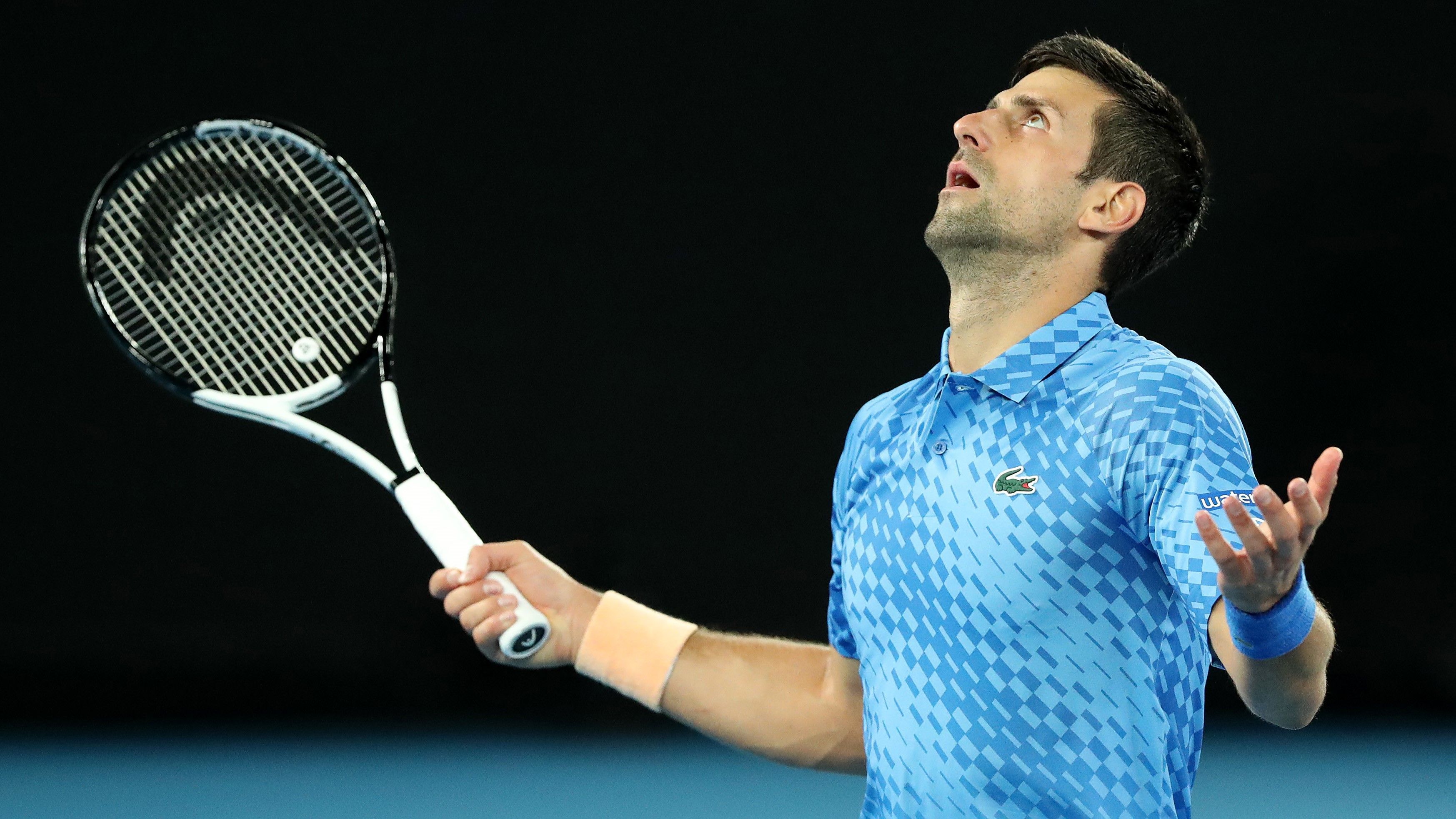 Novak Djokovic of Serbia reacts in his round one singles match against Roberto Carballes Baena.