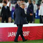 England coach Eddie Jones takes off his medal after defeat in the 2019 Rugby World Cup final.