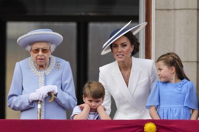 Queen Elizabeth II, from left, Prince Louis, Kate, Duchess of Cambridge, and Princess Charlotte on the balcony of Buckingham Palace, London, Thursday June 2, 2022, on the first of four days of celebrations to mark the Platinum Jubilee. 