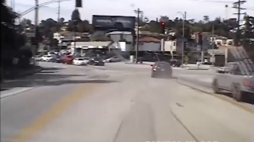 The squad car's dashcam shows the fugitive's car weaving through traffic as he attempts to evade police. Picture: LAPD