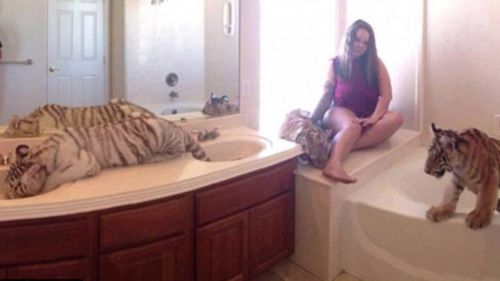 Mother who let tigers roam home charged with child endangerment