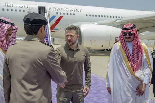 Ukraine's President Volodymyr Zelenskyy is greeted by Prince Badr Bin Sultan, deputy governor of Mecca, right, upon his arrival at Jeddah airport, Saudi Arabia, Friday, May 19, 2023.