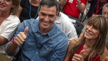 Spain&#x27;s Prime Minister Pedro Sanchez next to his wife Begona Gomez, gives a thumb up during a campaign closing meeting in Madrid, Spain, Friday, July 21, 2023. 